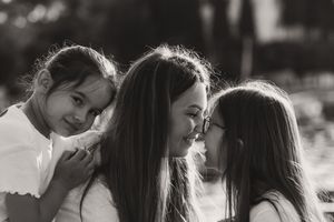 Black and white portrait series capturing playful interactions and laughter between two people.