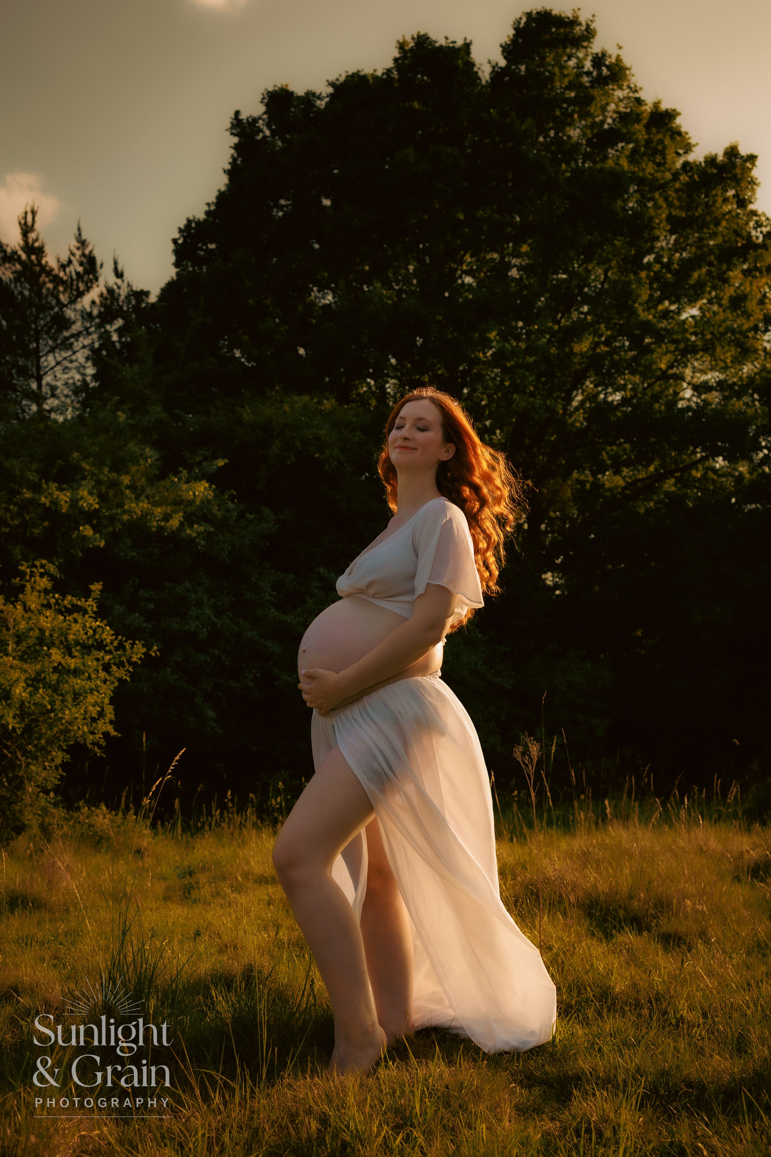 Outdoor maternity soulful, natural light, colourful, glorious, breeze blowing dress back ,smiling, Thetford, female empowerment session