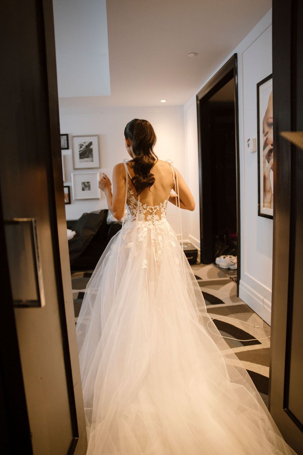 Ethereal bridal gown with flowing tulle train captured in a series of dreamy corridor shots.