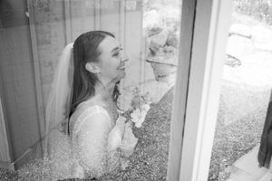 An intimate indoor portrait series with soft window lighting and rustic wood paneling.