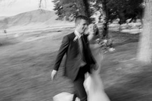 A black and white photo series showing playful movements and twirls outdoors.