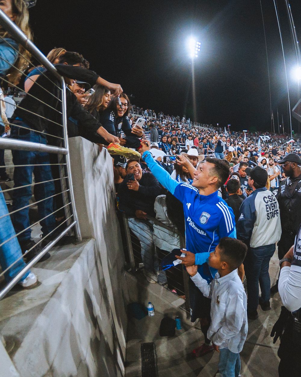 Hirving "Chuky" Lozano signs his autograph for fans at Snapdragon Stadium in San Diego, California