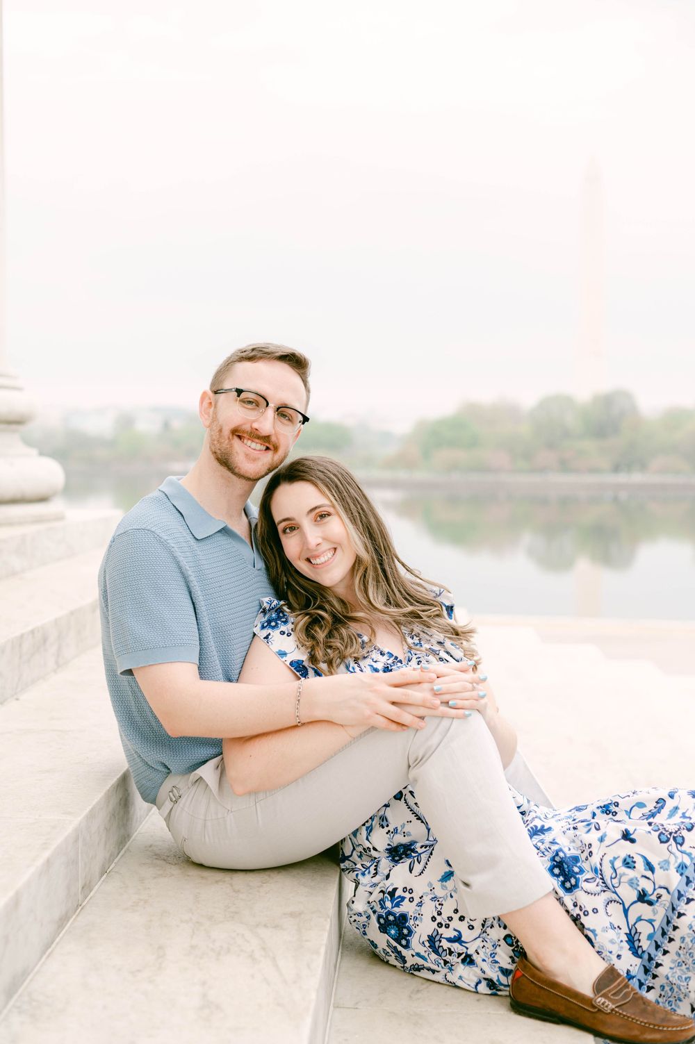 A casual portrait session on marble steps with the Tidal Basin in the background.