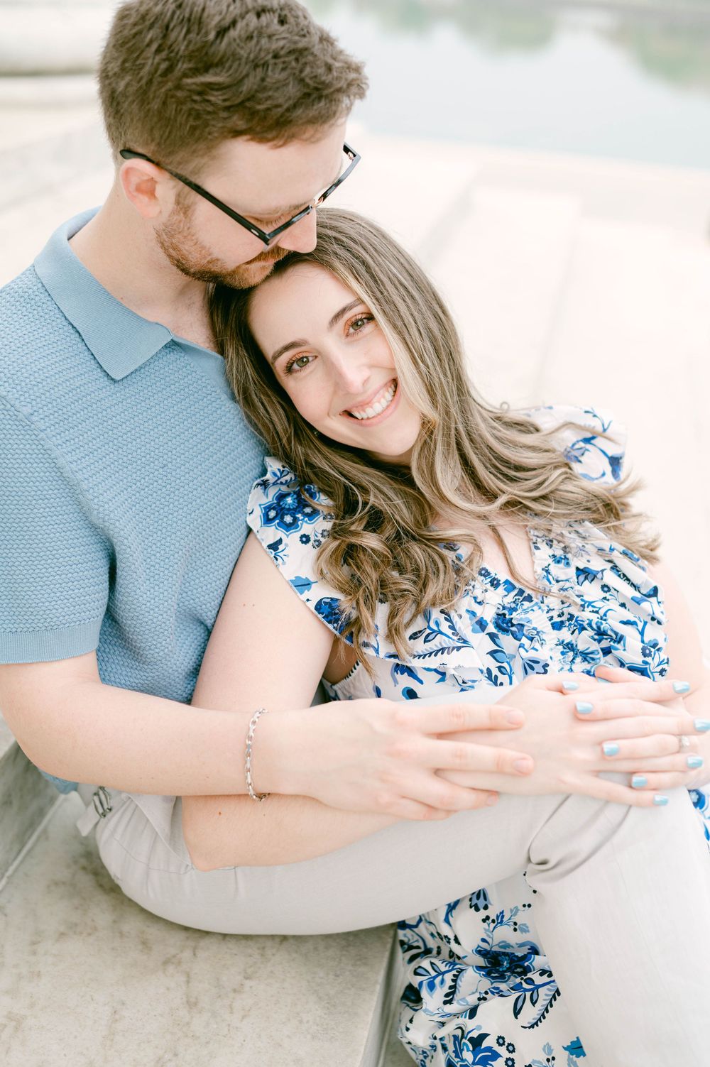 An intimate portrait showcasing affection and coordinated blue outfits.