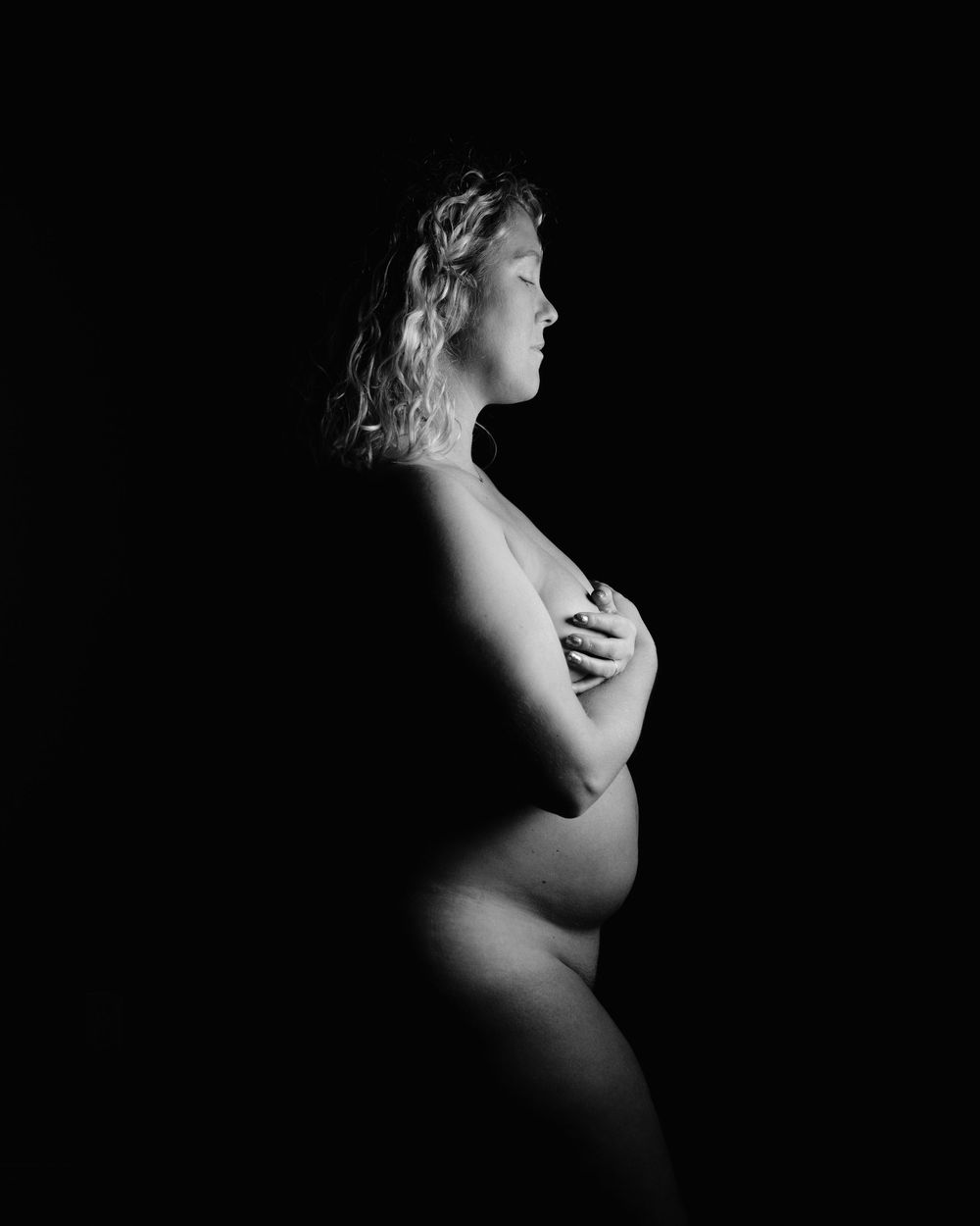 Dramatic black and white silhouette portraits showing artistic shadows and lighting.