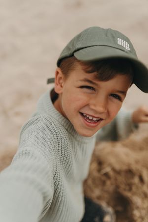 A candid beachside moment captured with warm natural lighting.  Branding photography, Devon