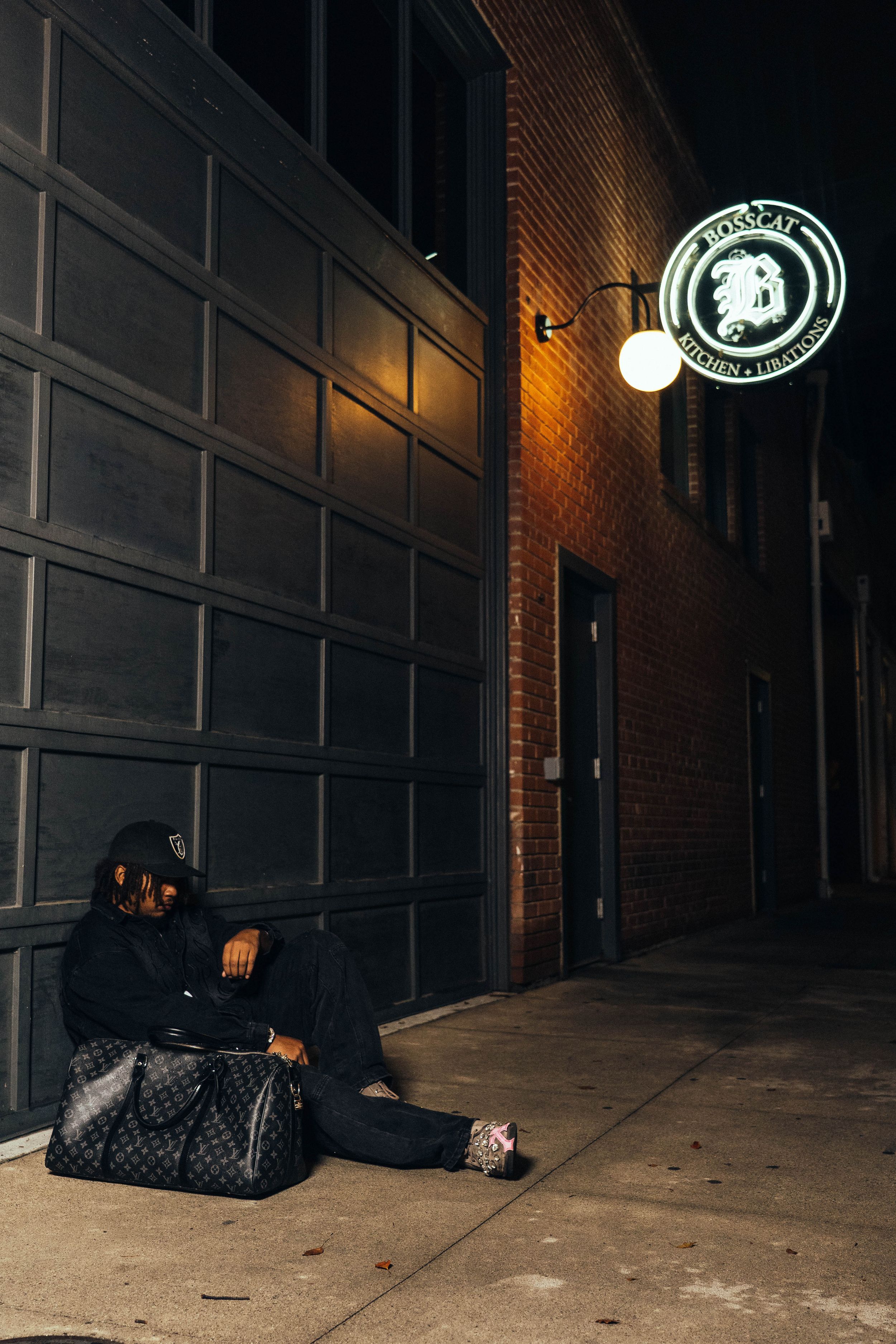 Dark urban alleyway with dim lighting and brick walls showing a series of progressive shots in low light conditions.