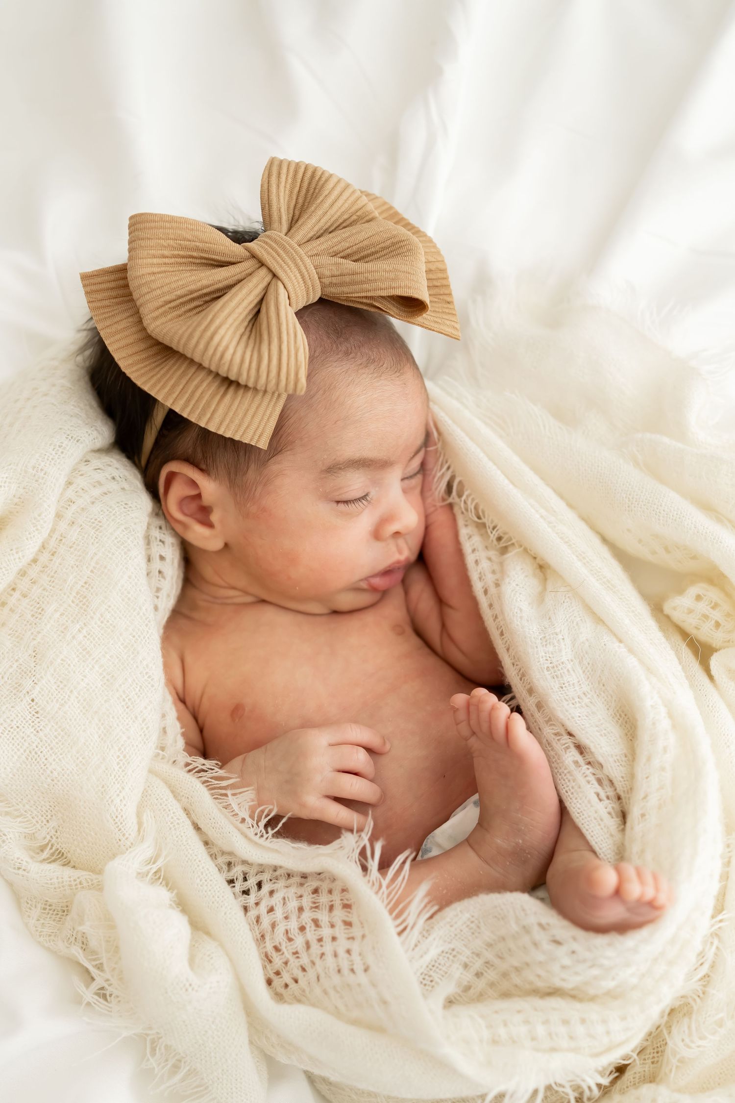 A professional photo session setup with teal and white balloons for a baby milestone or cake smash shoot.