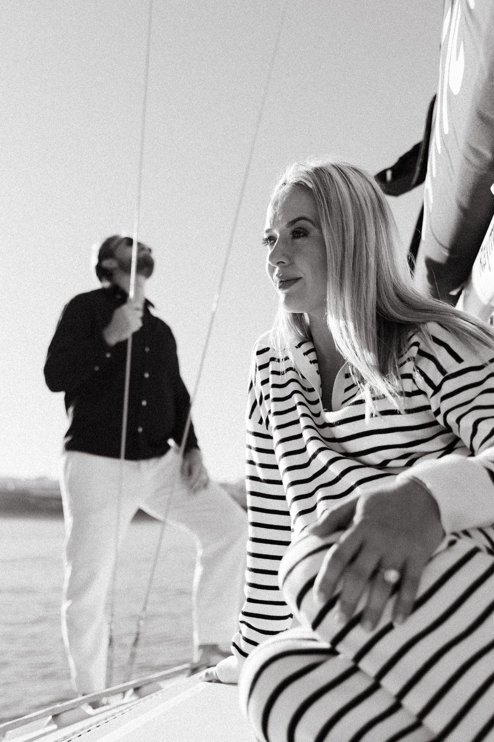 Woman in black and white striped top posing expressively in a sequence of dynamic movements.