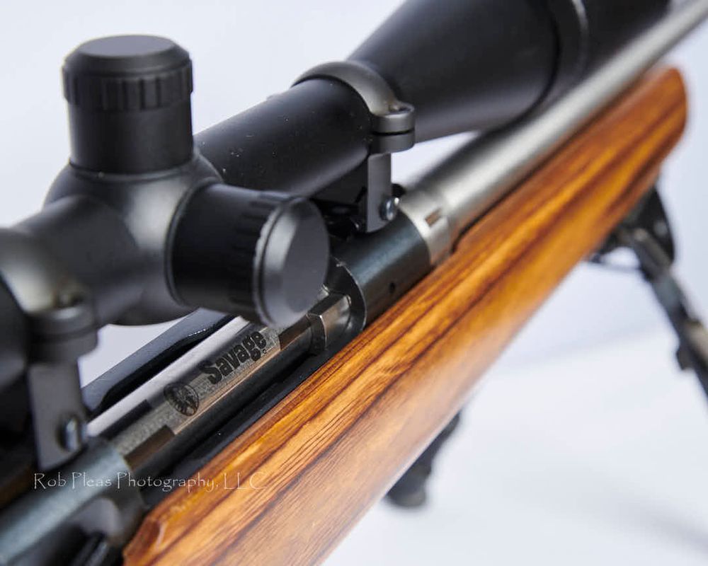 Closeup of the bolt-action and scope of Savage .22-250 varmint rifle.