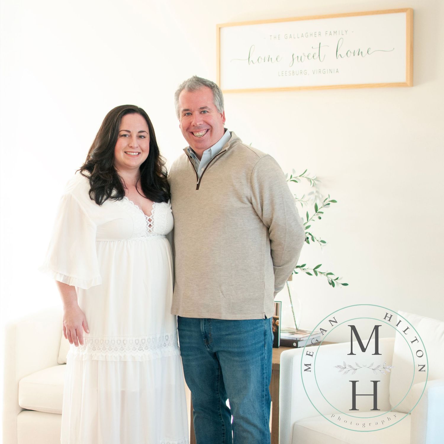 Couple standing in living room photo