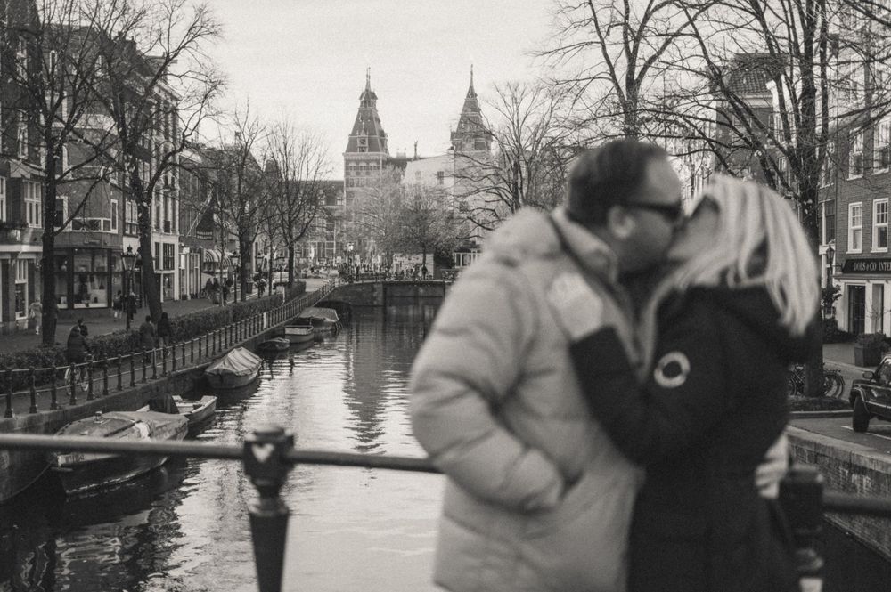 Winter scenes along Amsterdam canals with historic architecture and bare trees.