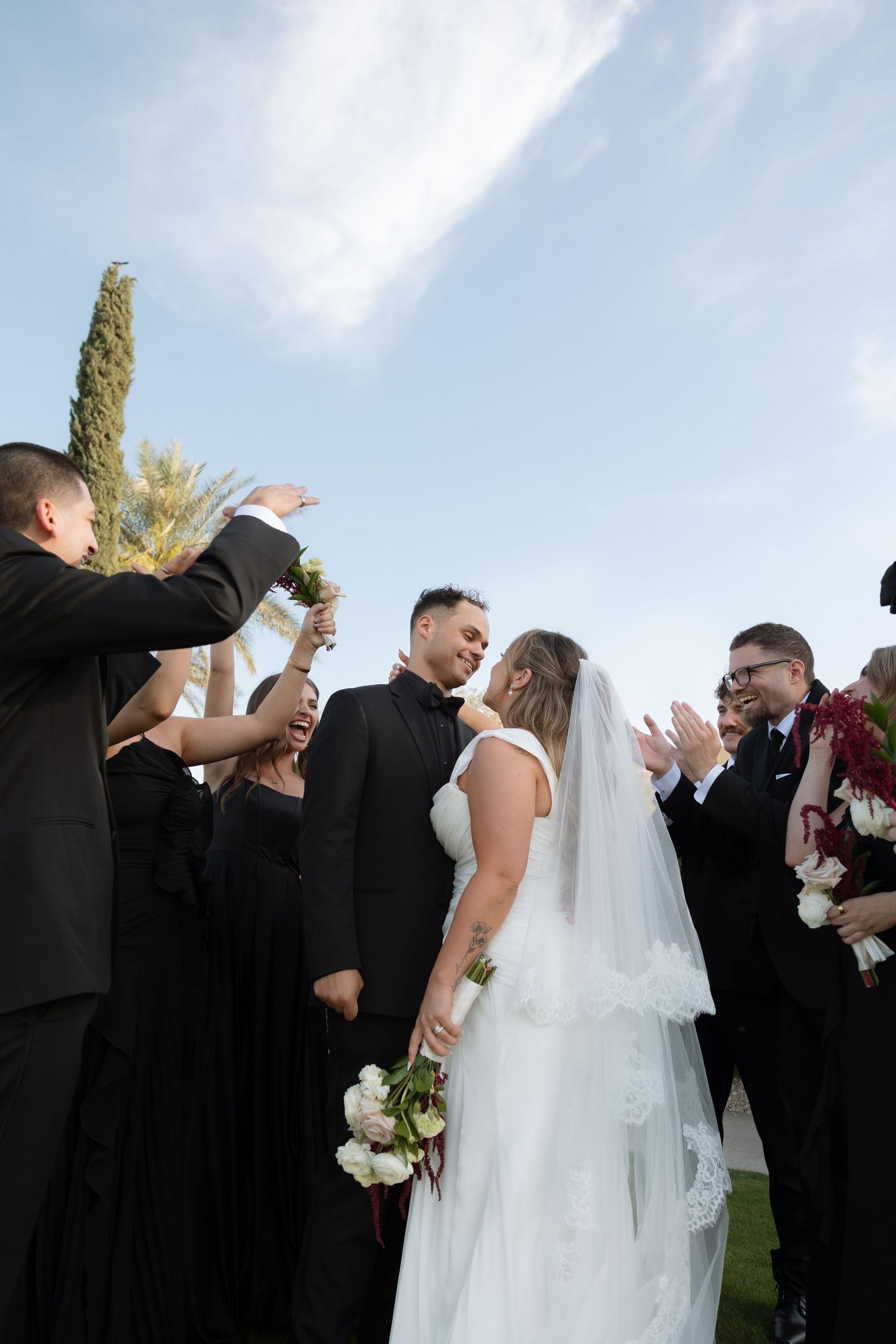 A romantic wedding moment captured against a mountainous backdrop.