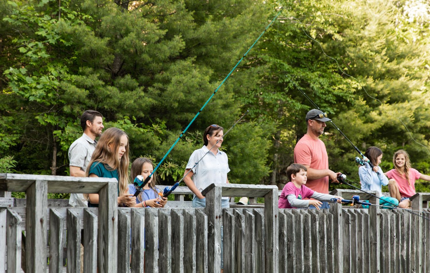 Photo of a family fishing at the lake with Zebco reels