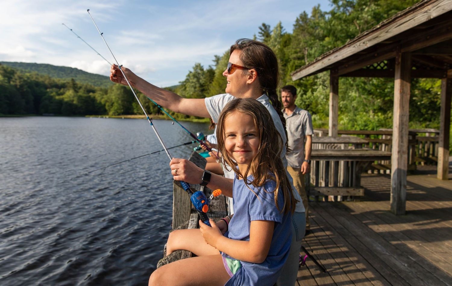 Photo of a mother and daughter fishing at the lake with Zebco reels