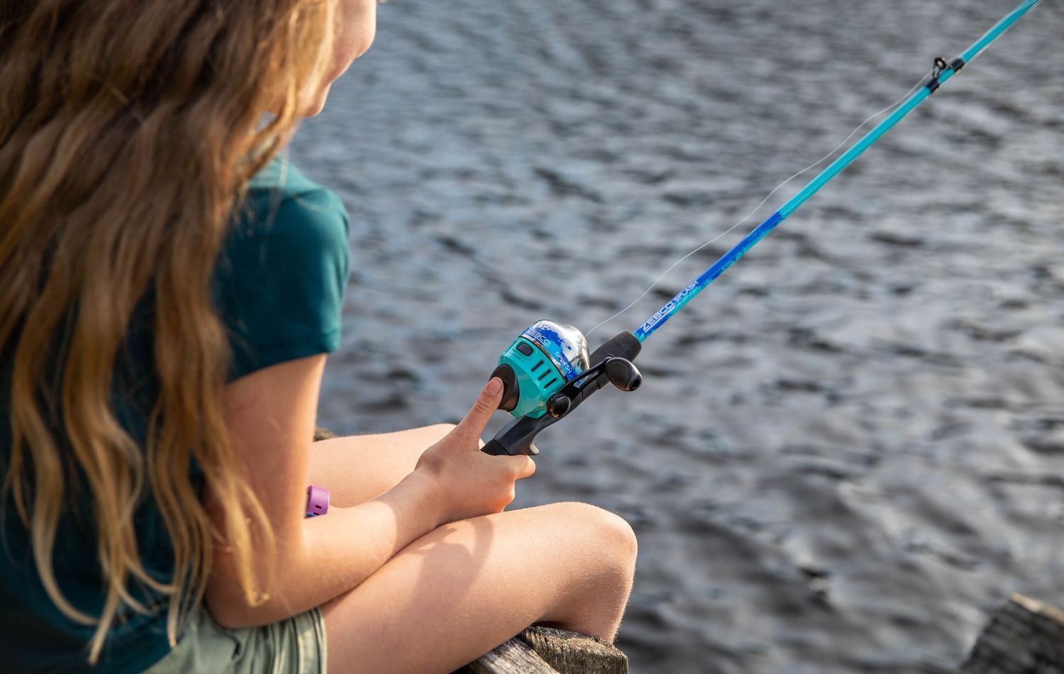 Photo of a family fishing at the lake with Zebco reels