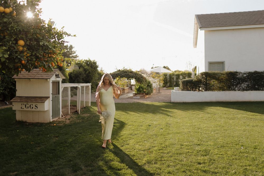 Sequence of photos showing a person in white clothing walking across a sunlit grassy lawn near a white house at sunset.