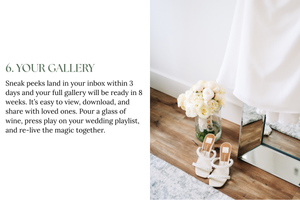 White and pink floral arrangement in a vase sits on a hardwood floor next to a gallery wall text and mirror.