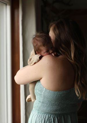 A series of photos showing the back of a mint green dress against white window blinds.