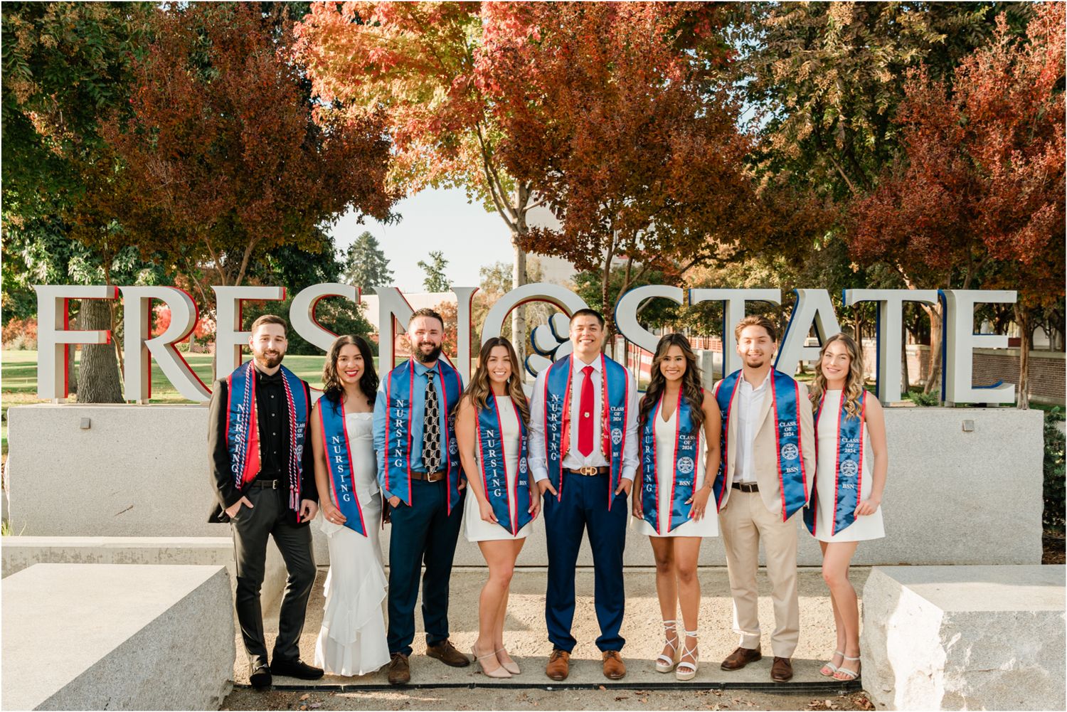 group of nursing students in front of fresno state university sign for grad session
