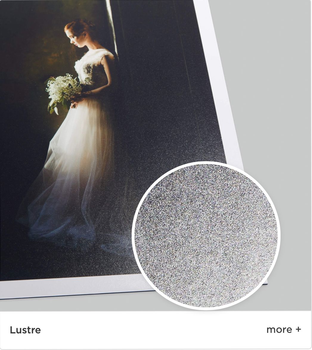 A soft-focused wedding photo shows a bride in a flowing white gown holding a bouquet against a dark background with sparkle texture.