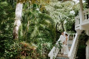 Intimate embrace between bride and groom at boutique hotel in Nosara, Costa Rica