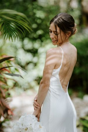 Elegant bridal portrait with tropical greenery in the background, Nosara destination wedding