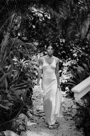 Bride laughing candidly during getting-ready moments in Nosara, Costa Rica