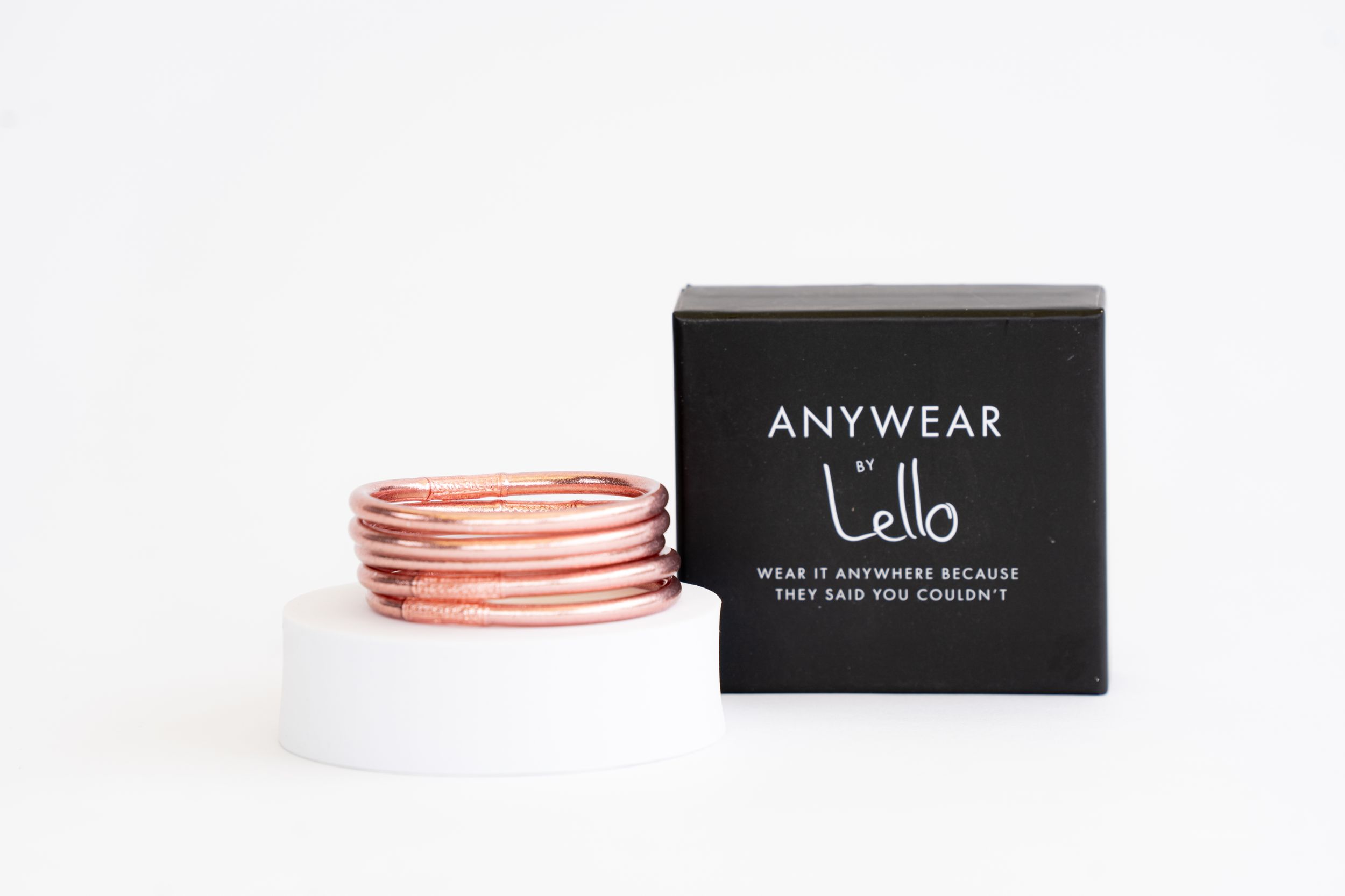 Anywear Lello branded black box with rose gold metallic bracelets.