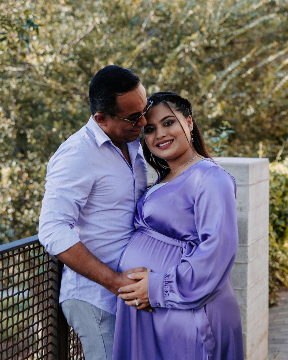 San Antonio Maternity Photography. A couple shares a tender moment against a natural backdrop.