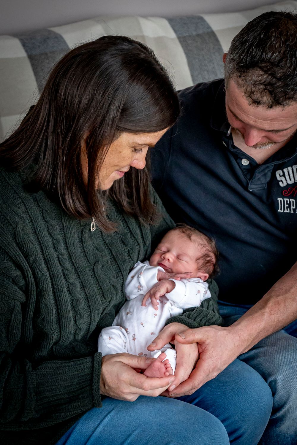 eleanor barry photography newborn waterford munster baby asleep in mams arms sitting on couch