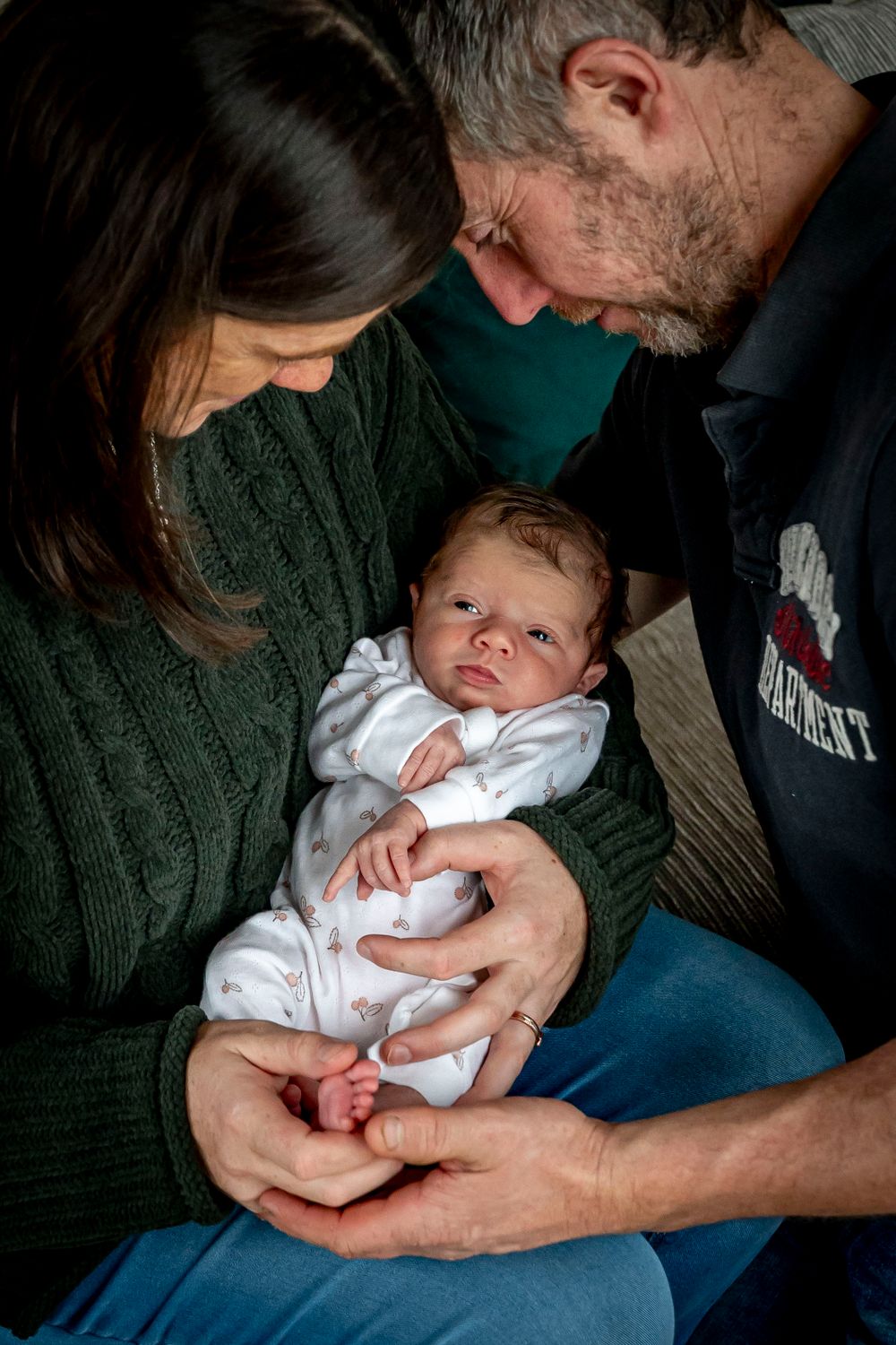 eleanor barry photography newborn waterford munster baby asleep in mams arms sitting on couch