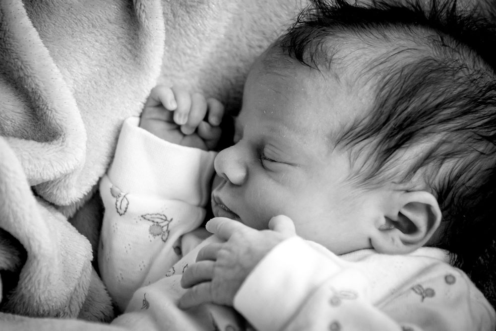 eleanor barry photography newborn waterford munster baby asleep in bouncer pink blanket