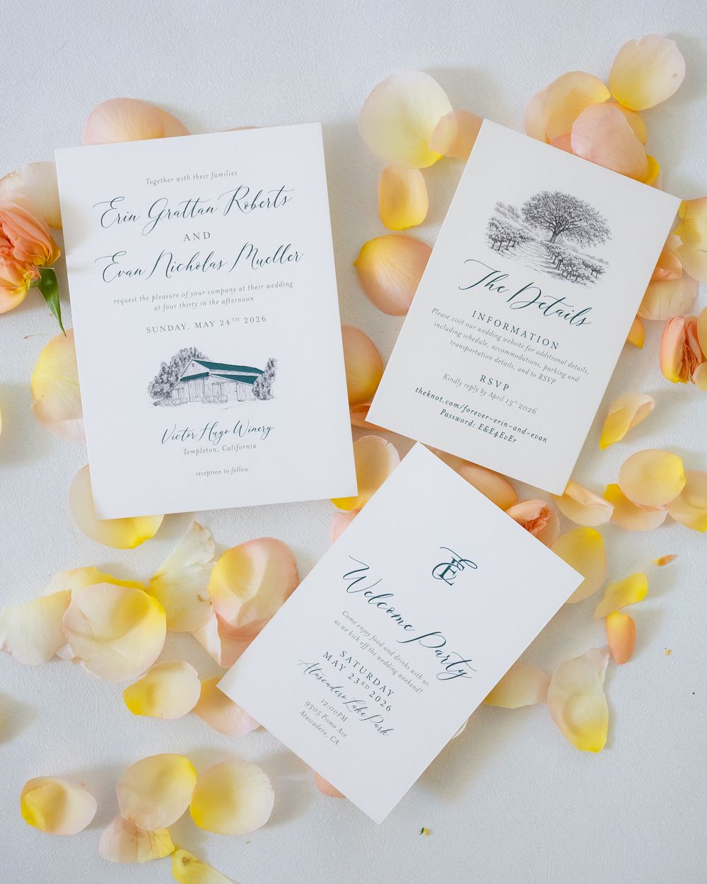 Elegant wedding invitation suite with venue illustration and details cards, surrounded by soft pink and yellow rose petals.