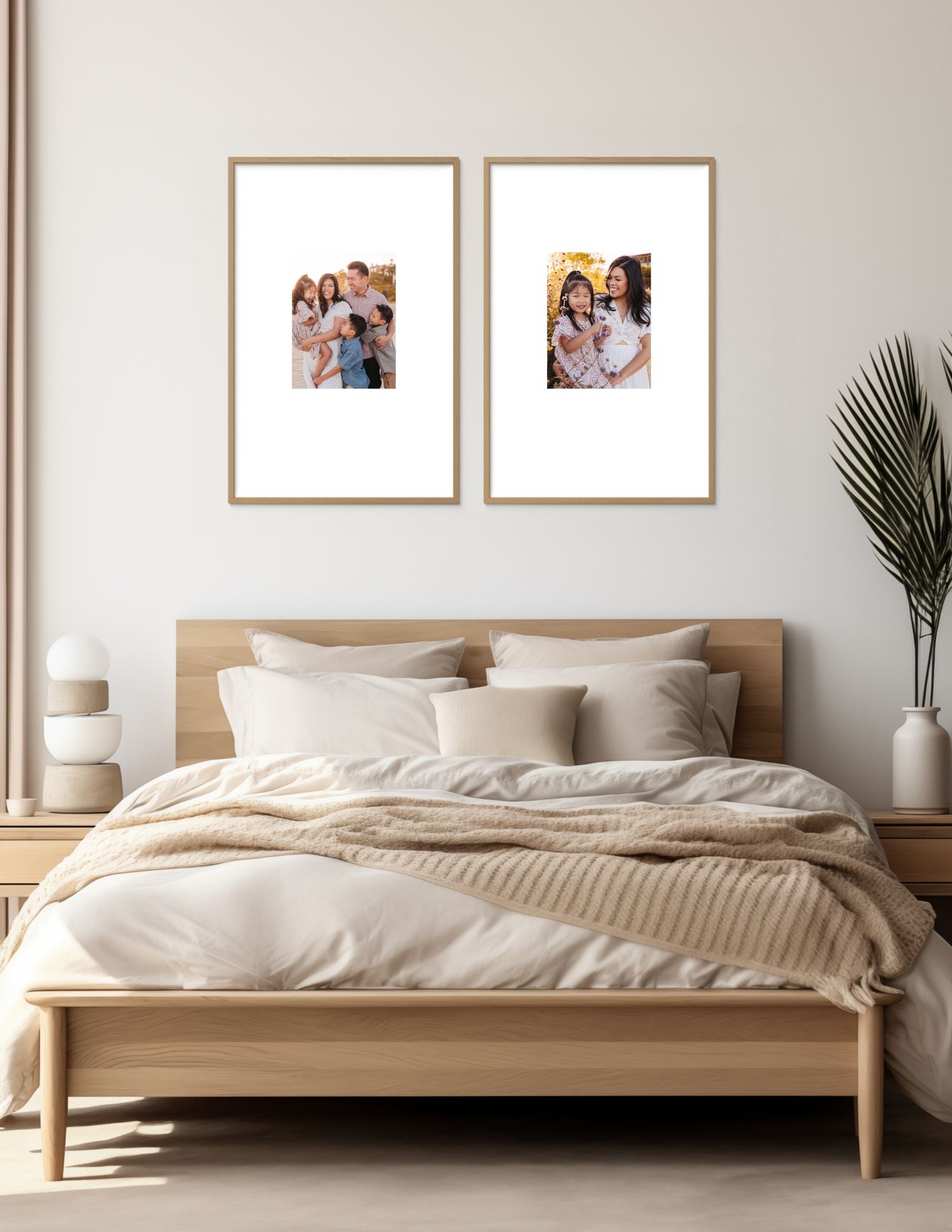 Modern bedroom interior with light wood bed frame, white bedding, beige walls, and two framed photos above the headboard.
