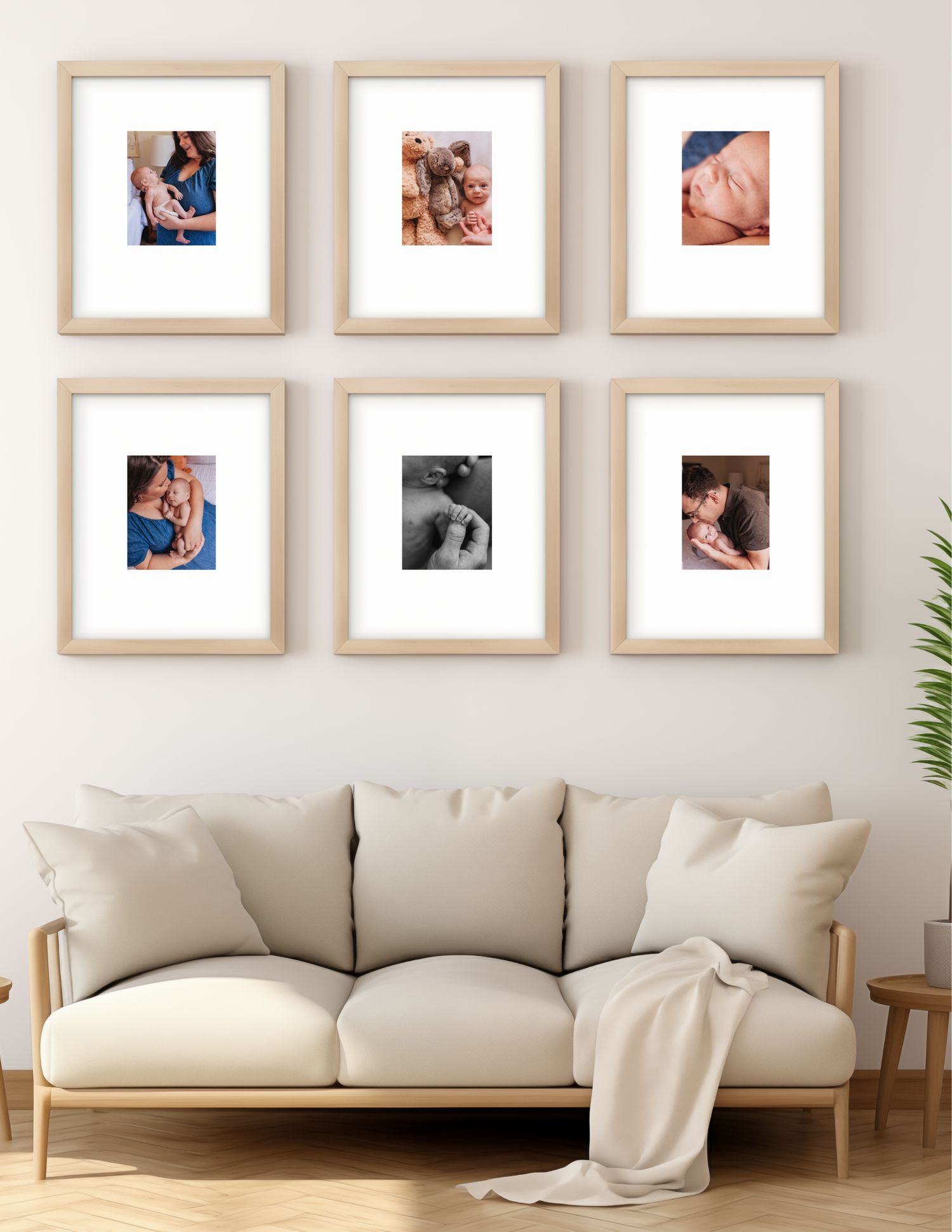 A cozy living room wall gallery featuring six wooden framed photos above a cream colored sofa with decorative cushions.