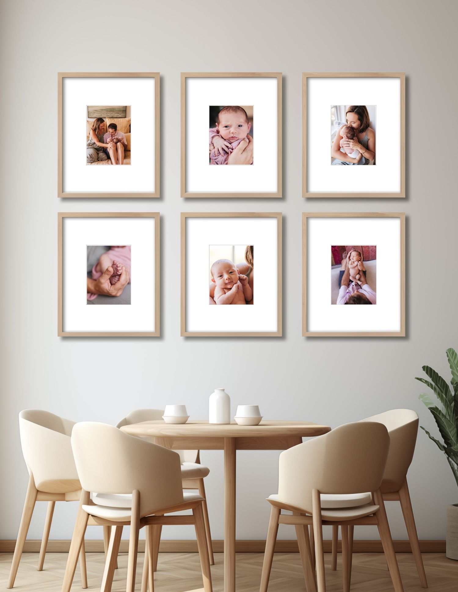 A dining room wall features six matching beige-framed photos arranged in a grid above a wooden table with cream chairs.