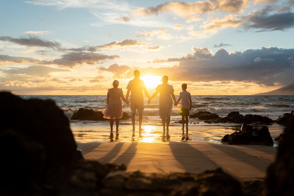 Maui family silhouette photo by ohwowfotos during sunset beach in Hawaii