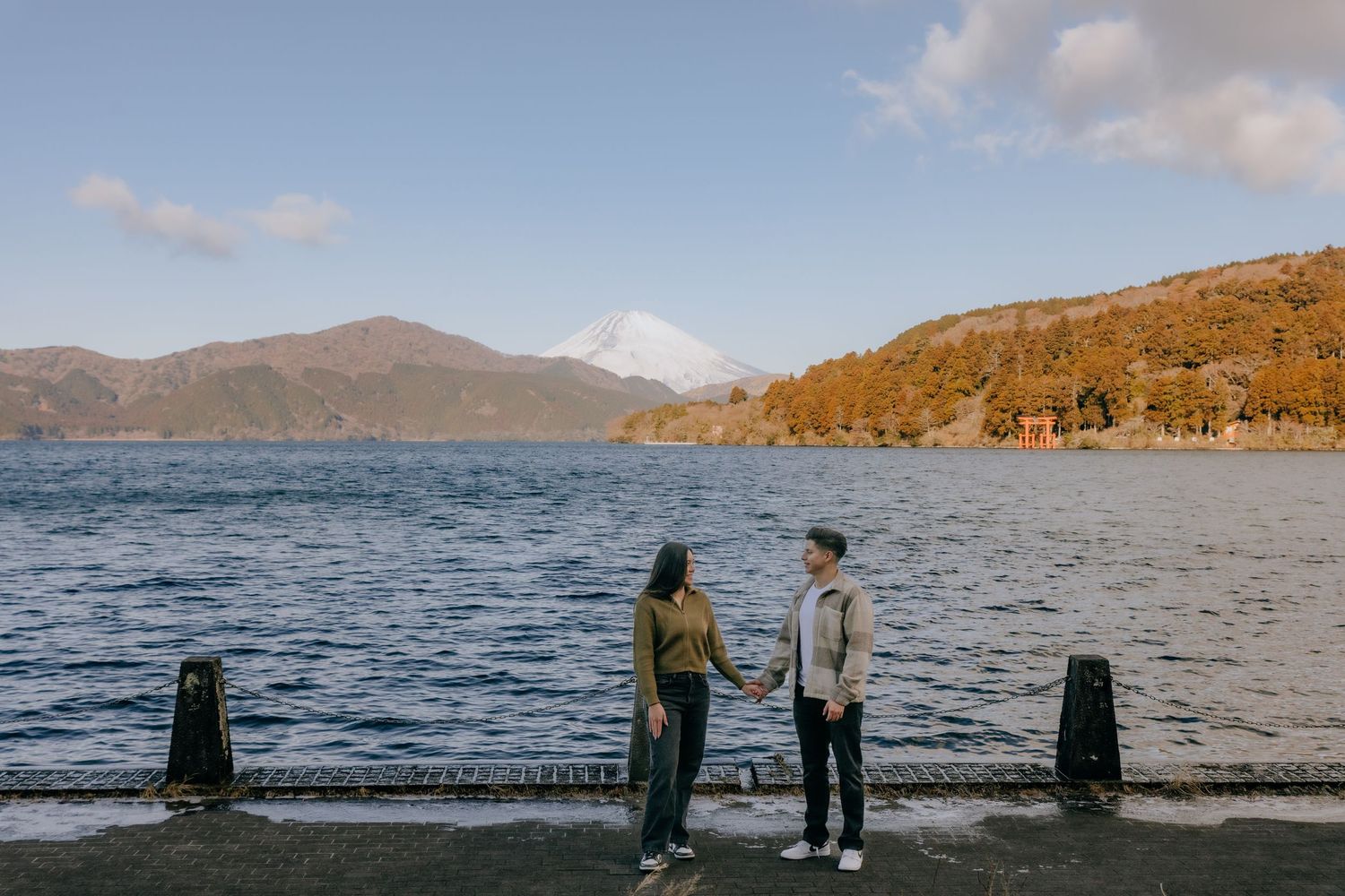 Couple engagement photo at Lake Ashi Hakone with Mount Fuji in the background