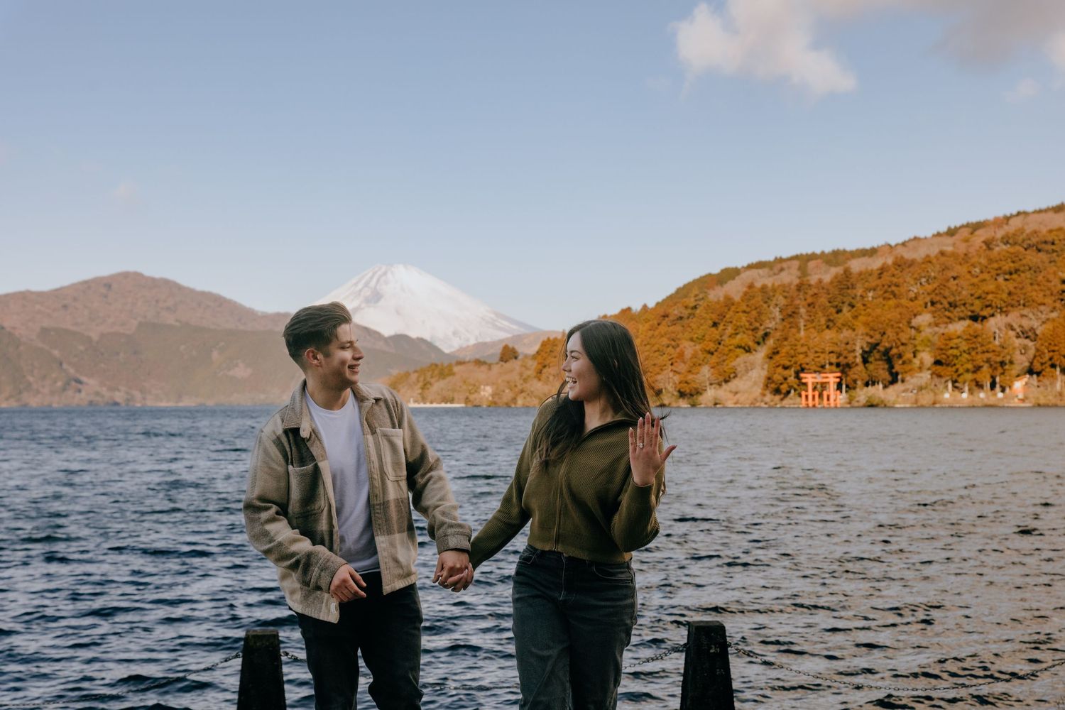 Couple engagement photo at Lake Ashi Hakone with Mount Fuji in the background