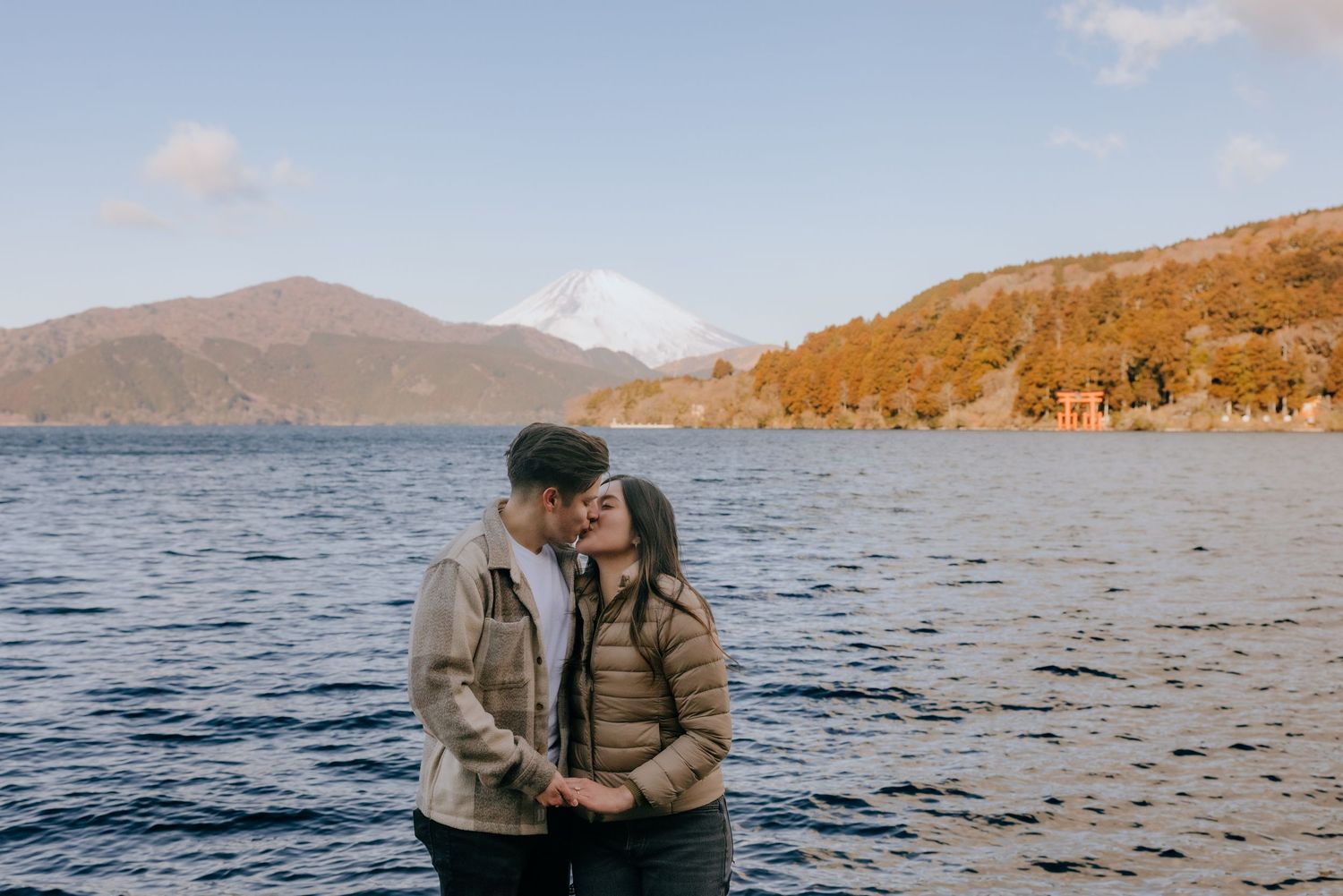 Couple engagement photo at Lake Ashi Hakone with Mount Fuji in the background
