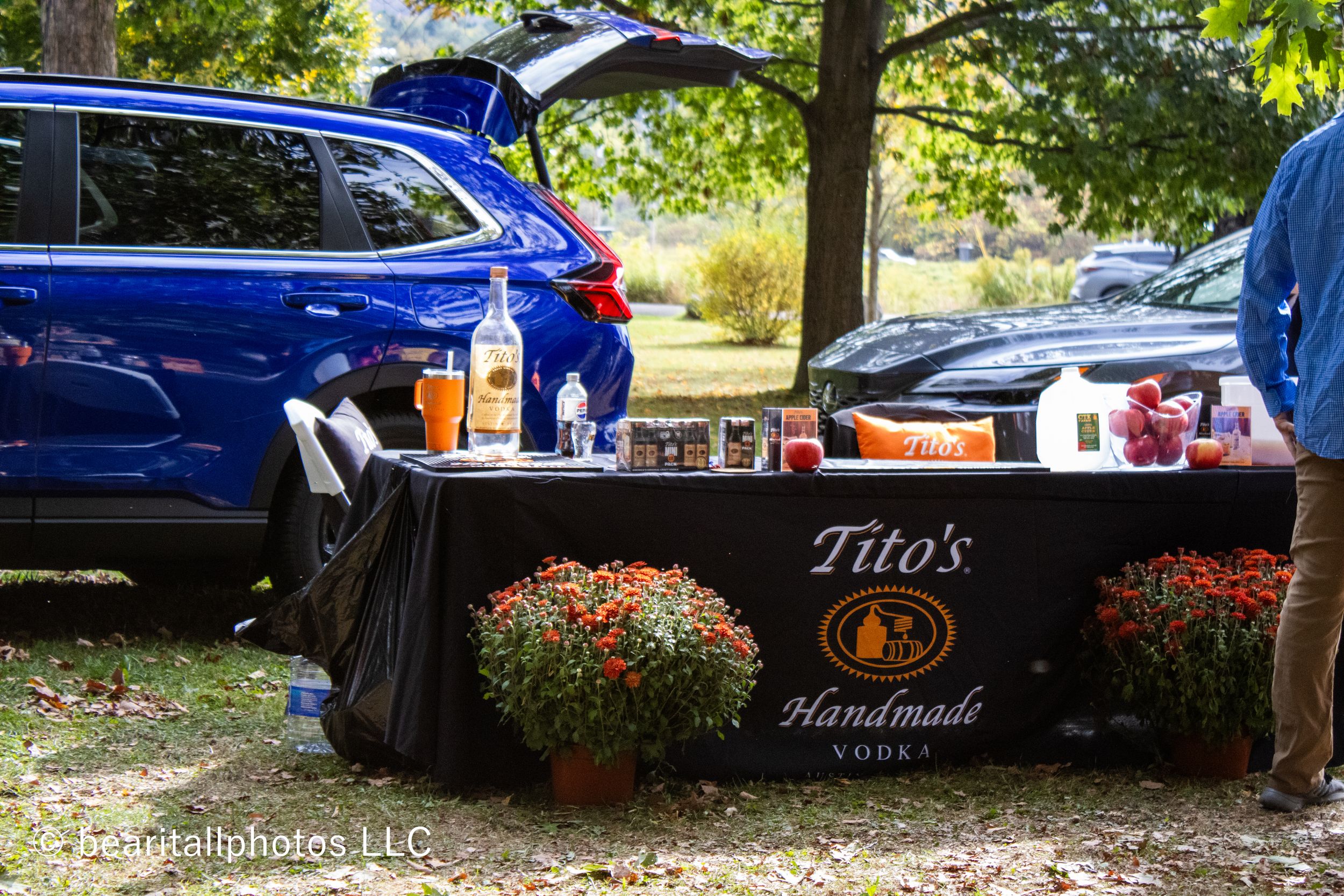 Tito's Handmade Vodka branded display at outdoor vendor festival.