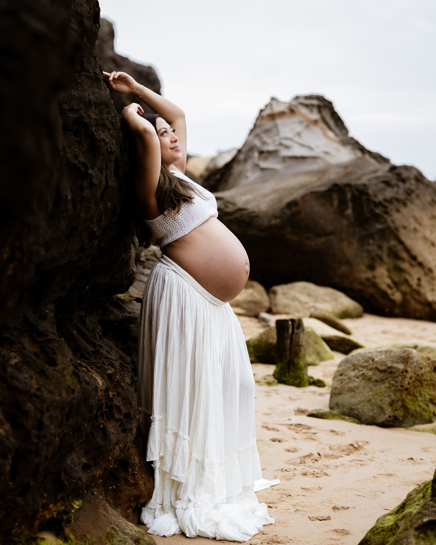 romantic maternity session with soft tones and dreamy backdrop