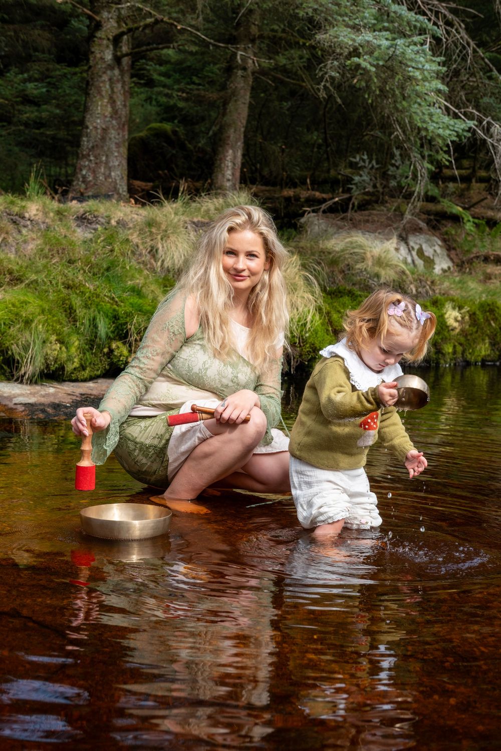 A sequence of images showing someone playing in a shallow forest stream with a red cup and reflective water.