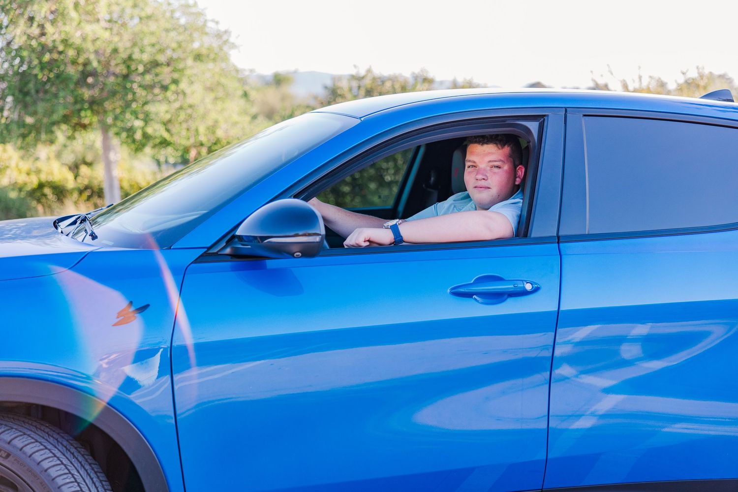 A bright blue sports car shown from multiple angles in a photo collage.