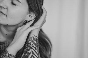 Black and white artistic close-up photo series showing partial views of someone's face and neck area.