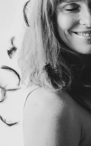 Black and white close-up portraits showing woman's profile and expressions in an artistic photo collage.