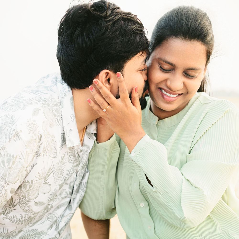 An intimate moment captured between a couple in soft lighting.
