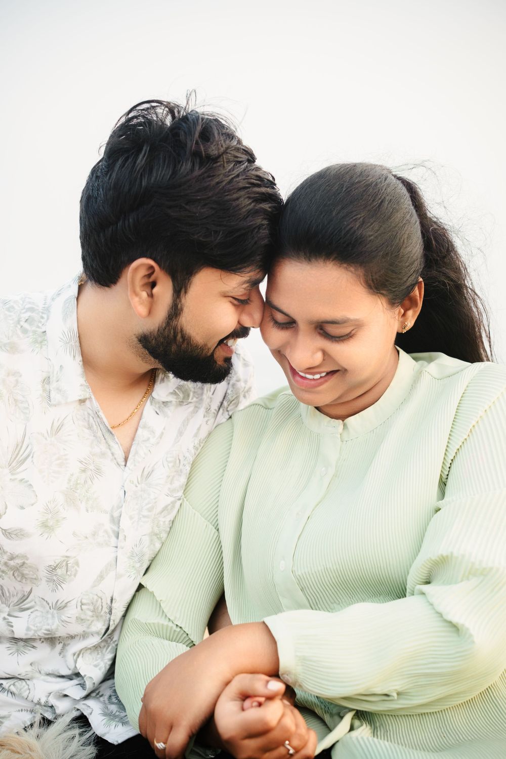 A couple shares a tender moment while enjoying each other's company.