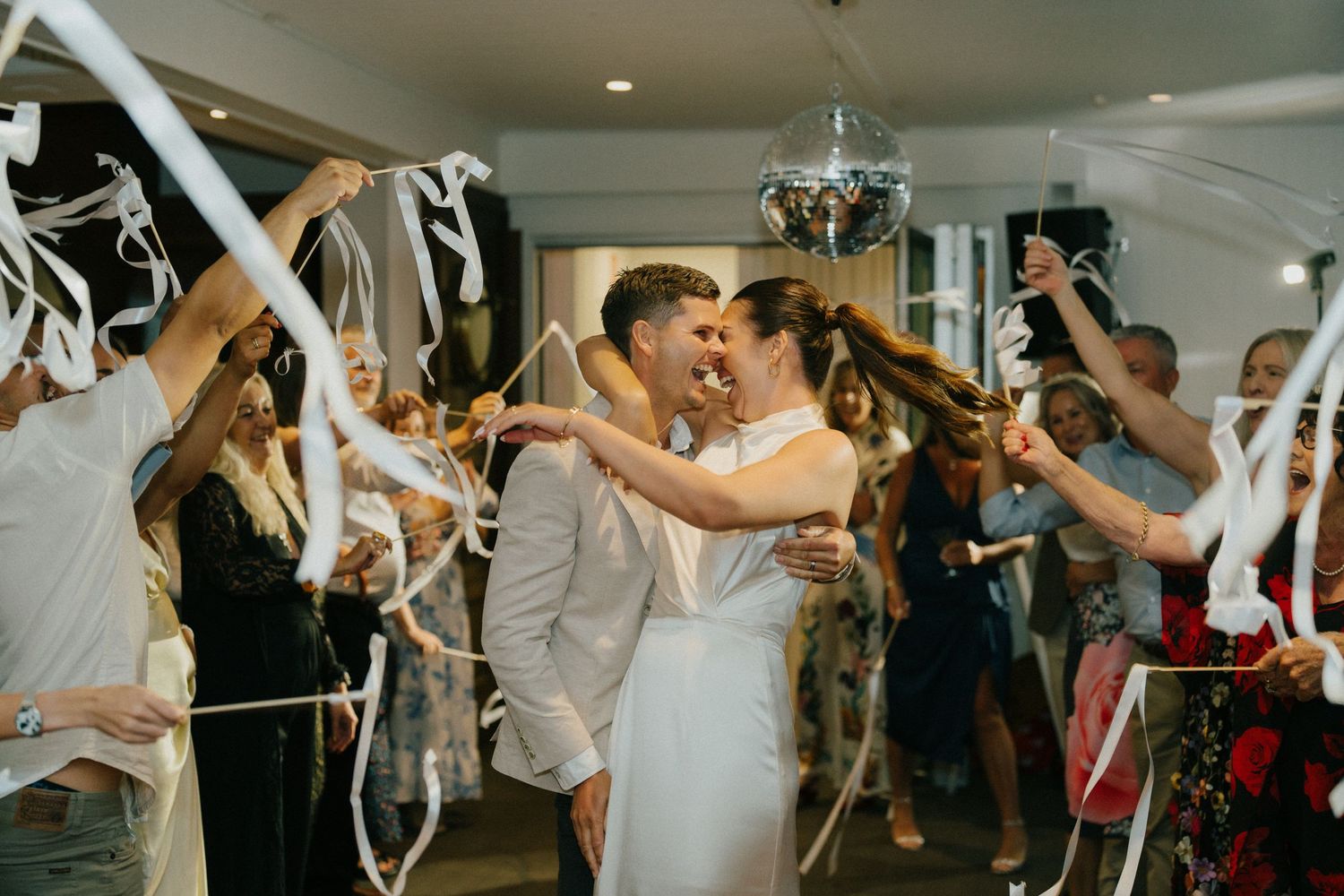 Heartfelt and fun moments at Noosa Boathouse reception, captured by a documentary wedding photographer.”